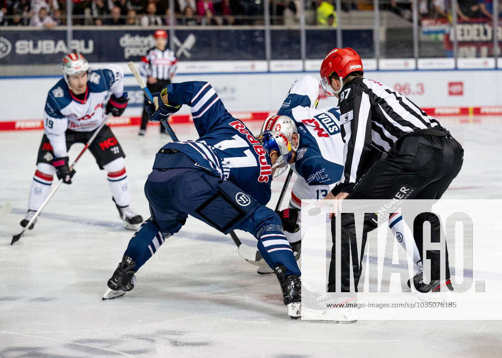 Linesman Marius Woelzmueller Conducts A Faceoff Between Markus