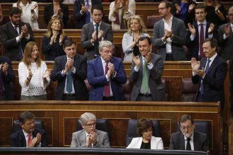 Spanish Prime Minister Mariano Rajoy R Receives The Applause From