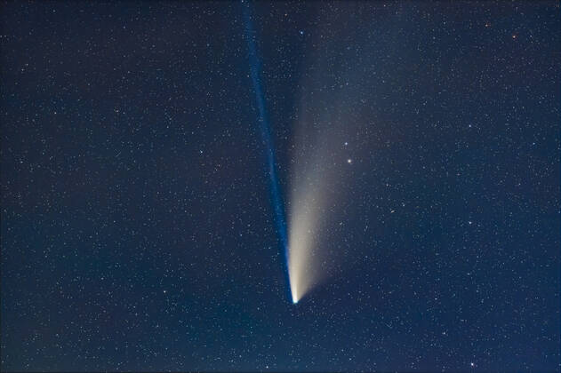 Spectacular View Of The Comet Neowise On A Dark Purple Night Sky