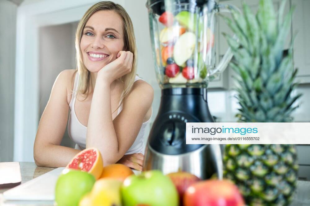 Pretty Blonde Woman Happy To Prepare A Smoothie Pretty Blonde Woman