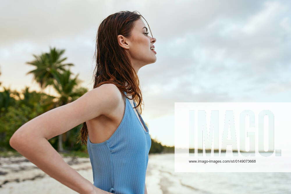 Woman In Blue Swimsuit On The Beach Island Lifestyle Woman In Blue