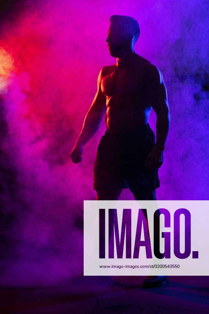 Silhouette Of Shirtless Muscular Sportsman With Naked Torso Looking