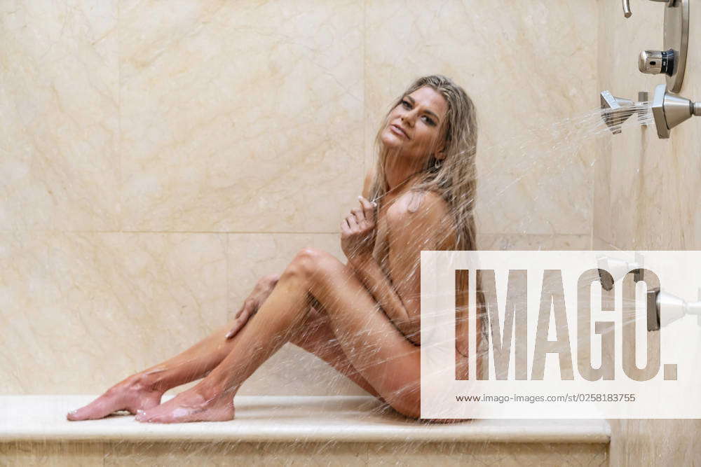 Gorgeous Blonde Model Baths Nude In A Home Environment A Gorgeous