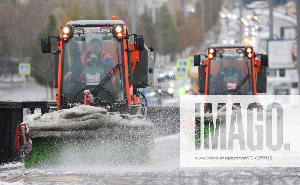 RUSSIA MOSCOW OCTOBER 27 2023 Utility Workers Drive Snow Ploughs