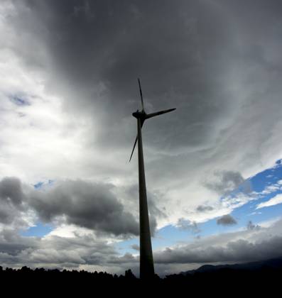 Wind Turbine Silhuette With Dark Landscape Background