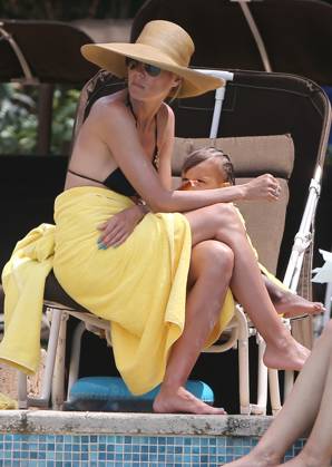 Exclusive Heidi Klum Shows Off Her Toned Bikini Body While Lounging By