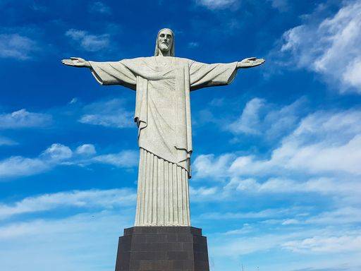 The Statue Christ The Redeemer In Rio Brazil And The Cloudy Sky In The