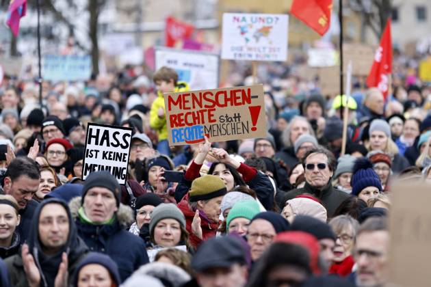 Signs Held By Protesters At A Demonstration Organized By The Alliance