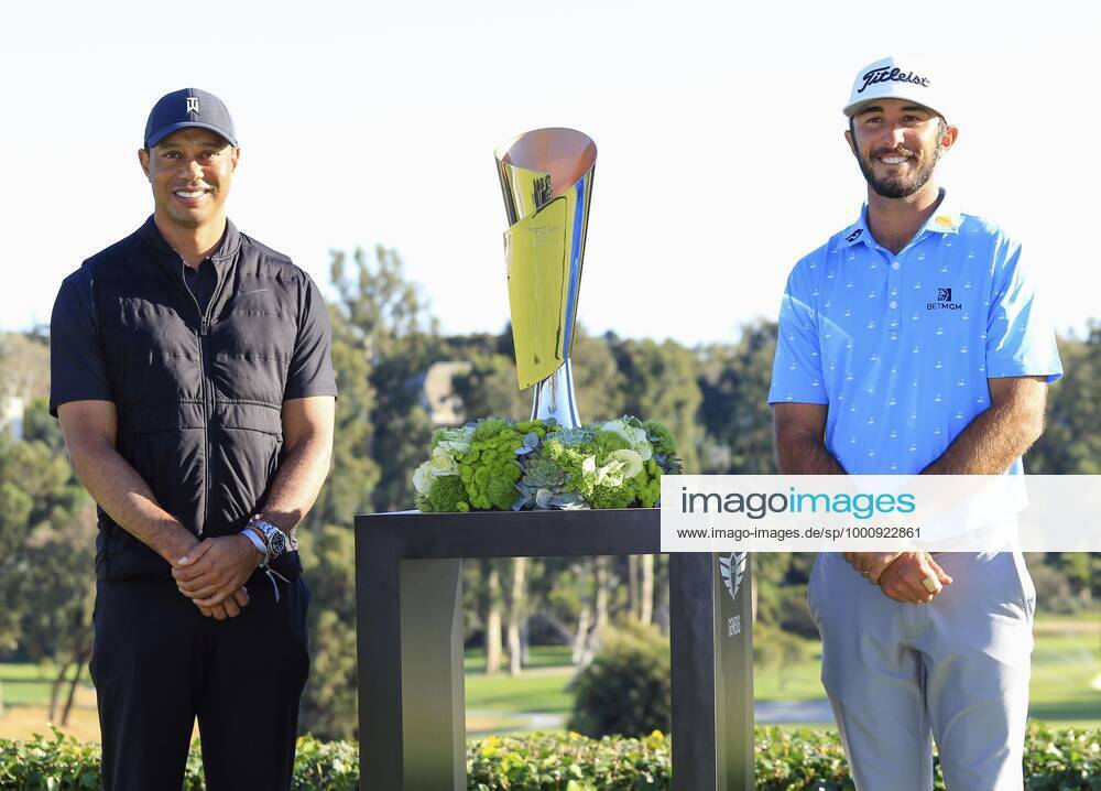 Golf: Genesis Invitational Max Homa (R) of the United States poses with his trophy after winning the Genesis Invitational golf tournament at Riviera Country Club in Pacific Palisades, California, on Feb. 21, 2021, next to tournament host Tiger Woods.