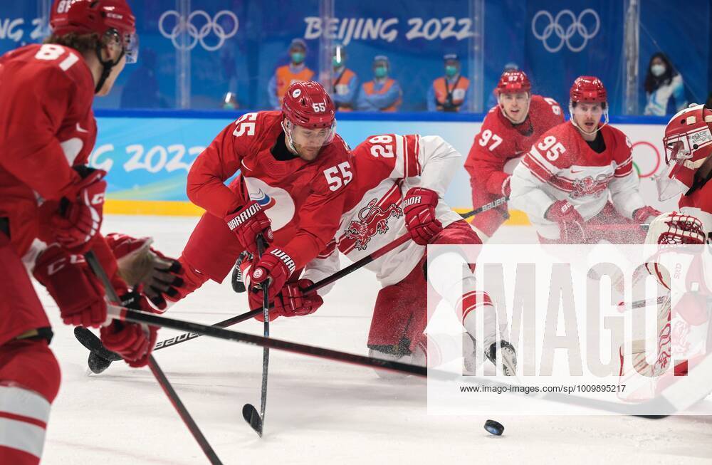China Olympics 2022 Ice hockey, Eishockey Men ROC - Denmark 8116425 16.02.2022 Russian Olympic Committee s Vladimir Tkachyov and Denmark s Emil Kristensen vie for the puck in the men s ice hockey qualification play-off match between the Russian Olympic Committee s team and Denmark during the Beijing 2022 Winter Olympic Games, Olympische Spiele, Olympia, OS at Wukesong Sports Centre in Beijing, China. Grigory Sysoev Sputnik Beijing China