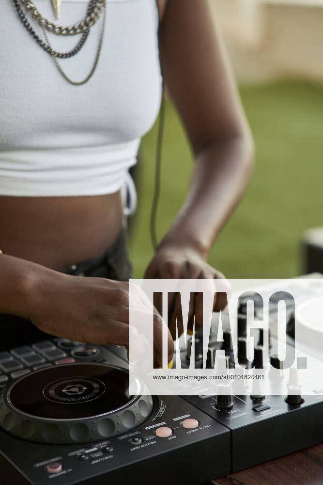 Crop view of DJane working on mixing board model released Symbolfoto property released VEGF02115