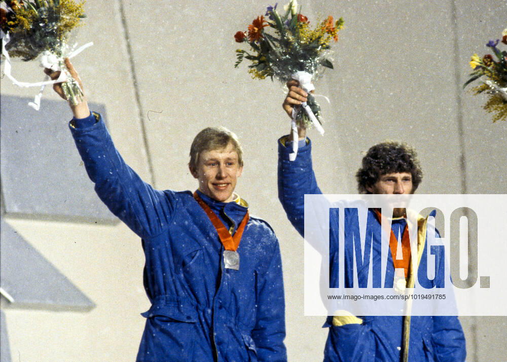 ARCHIVE 1984 02 19 Silver medallist Gunde Svan and gold medallist Thomas Wassberg wave with the flower tassels in their hands and their medals around their necks during the medal ceremony for the 50 km cross-country skiing event at the Winter Olympics in Sarajevo, Yugoslavia 19 February 1984 Sarajevo Bosnia Herzegovina
