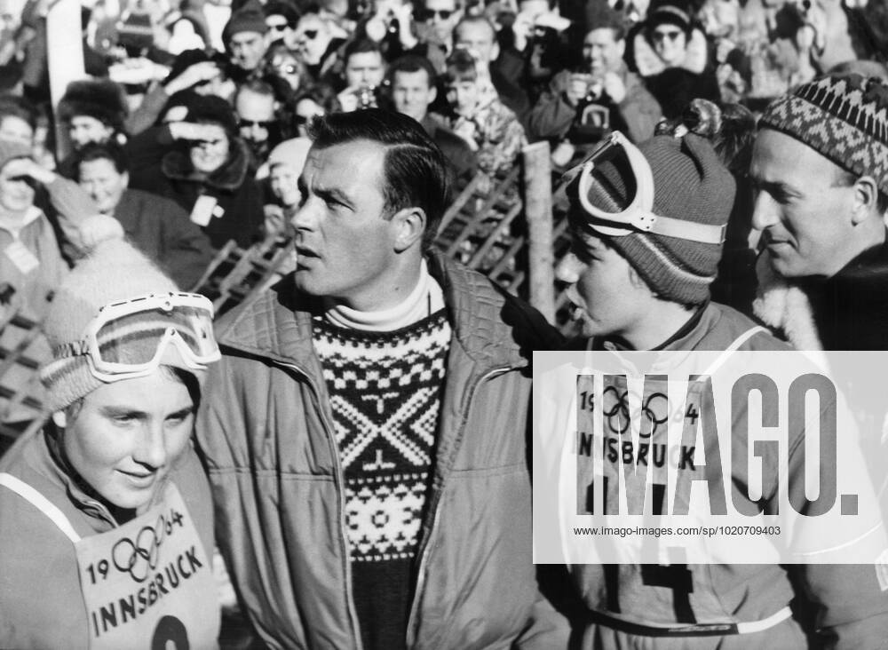 1964 Winter Olympic Games, Olympische Spiele, Olympia, OS 1964 Winter Olympic Games - Innsbruck, Austria Austrian ski legend Toni Sailer with the Goitschel sisters of France after the Giant Slalom event. Marielle Goitschel won the gold medal in the Giant Slalom and the silver medal in the Slalom and Christine Goitschel (no. 14) won the gold medal in the Slalom and the silver medal in the Giant Slalom.. 3 February 1964 TopFoto Austria