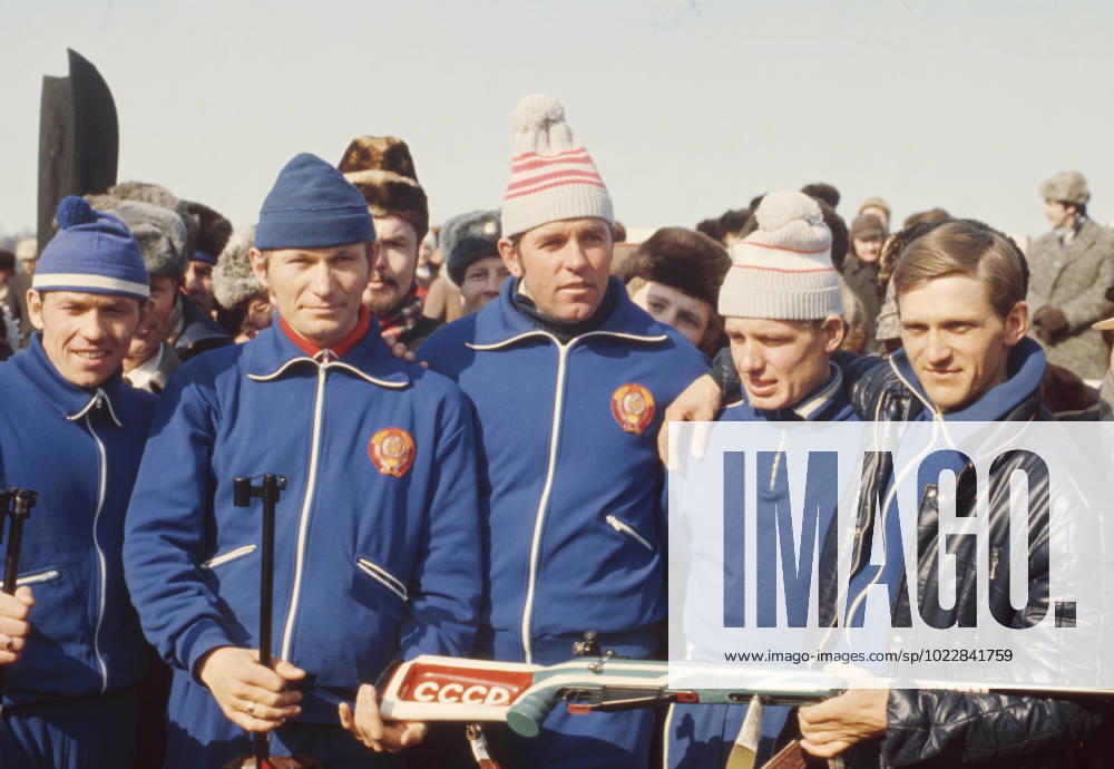 Minsk, Byelorussian SSR, USSR. Members of the USSR biathlon team Nikolai Kruglov, Yuri Kolmakov (1st and 2nd L), Alexander Tikhonov, Alexander Ushakov (1st and 2nd R), who won the 4x7.5 km relay, and their coach Alexander Privalov (C) pose for a photo with a rifle during the award ceremony at the 13th Biathlon World Championships in the Raubichi sports complex. Vyacheslav Un Da-Sin, Alexander Yakovlev TASS 32486299