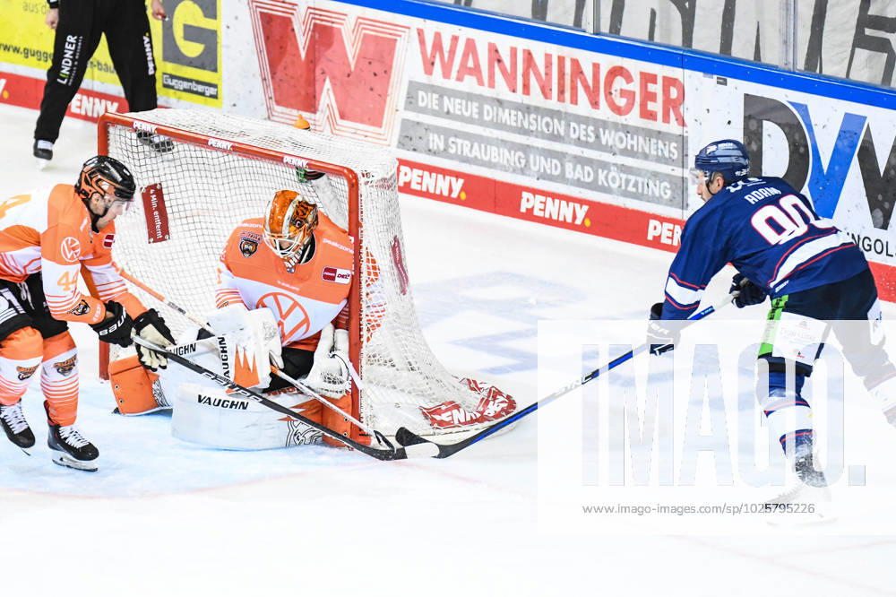 Straubing Tigers vs Grizzlys Wolfsburg, ice hockey, German Ice Hockey League, Penny DEL, 1 matchday playoffs quarterfinals, season 2022 2023, 14 03 2023 Luke Adam Straubing Tigers with the chance before Dustin Strahlmeier Grizzlys Wolfsburg , ice hockey men, German Ice Hockey League, Penny DEL, 1 matchday playoffs quarterfinals, season 2022 2022 on 14 03 2023 at the Eisstadion am Pulverturm, Straubing Tigers blue vs Grizzlys Wolfsburg white