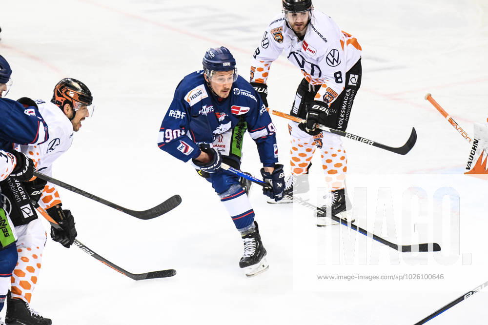 Straubing Tigers vs Grizzlys Wolfsburg, ice hockey, German ice hockey league, penny DEL, 3 matchday playoffs quarterfinals, season 2022 2023, 19 03 2023 Luke Adam Straubing Tigers on the puck in front of Jordan Murray Grizzlys Wolfsburg , ice hockey men, German ice hockey league, penny DEL, 3 matchday playoffs quarterfinals, season 2022 2022 on 19 03 2023 at Eisstadion am Pulverturm, Straubing Tigers blue vs Grizzlys Wolfsburg white