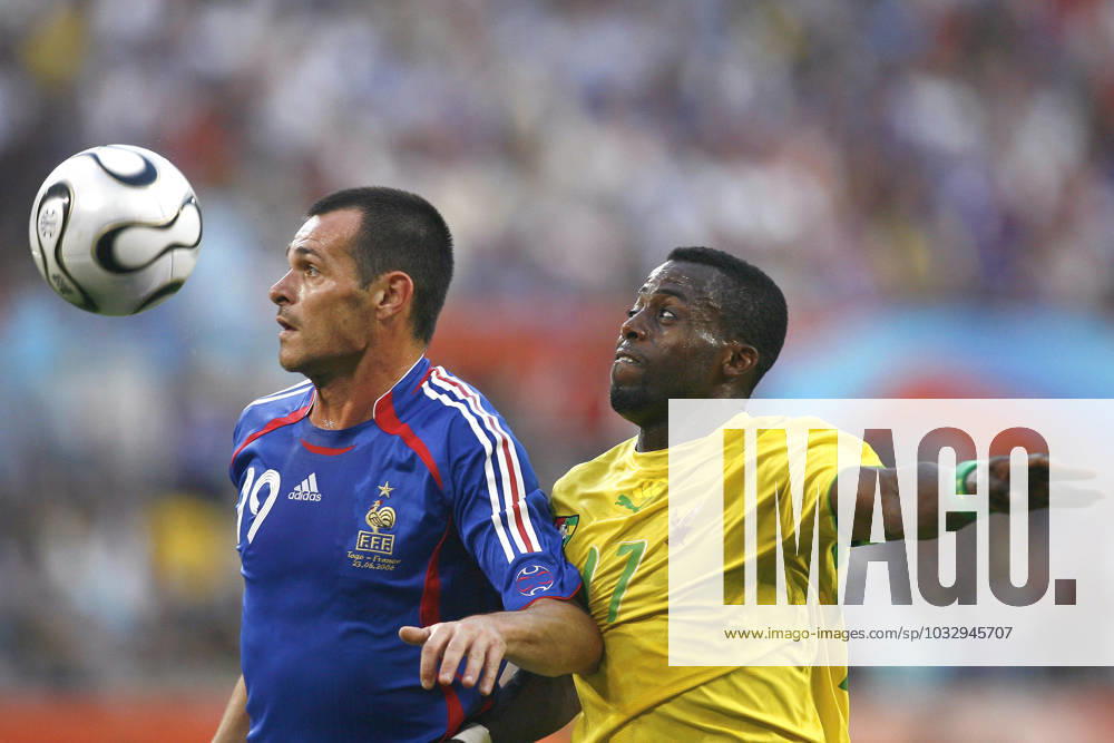 World Cup 2006-Group G, France vs Togo France s Willy Sagnol and Togo s Mohammed Kader-Toure battle for the ball during the 2006 FIFA World Cup, WM, Weltmeisterschaft, Fussball Group G, France vs Togo, in Cologne, Germany, on June 23, 2006. France won 2-0. Photo by Christian Liewig ABACAPRESS.COM Cologne Germany