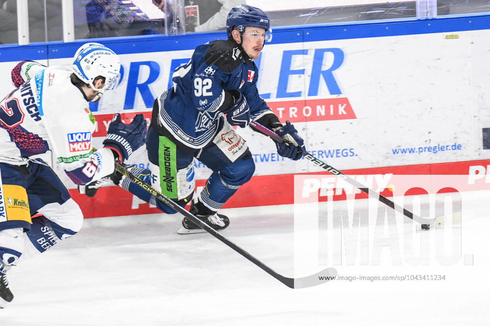 Straubing Tigers vs Grizzlys Wolfsburg, Ice Hockey, German Ice Hockey League, Penny DEL, Matchday 3 Playoffs Quarterfinals, Season 2022 2023, 19 03 2023 Marcel Brandt Straubing Tigers at the boards against Thomas Schemitsch Eisbären Eisbaeren Berlin , Ice Hockey Men, German Ice Hockey League, Penny DEL, PlayOffs Semi-Final, Matchday 4, Season 2023 2024 on 07 04 2024 at the Eisstadion am Pulverturm, Straubing Tigers blue against Eisbären Eisbaeren Berlin white