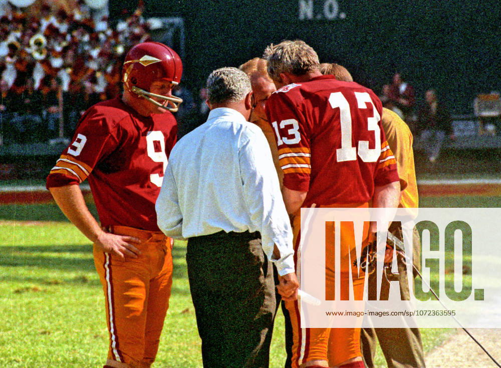 Washington Redskins quarterback Sonny Jurgensen 9, left, speaks to coaches Bill Austin and Vince Lombardi, and back-up quarterback Frank Ryan 13 on the sidelines during a break in the action against the New York Giants at RFK Stadium in Washington, D.C. on October 19, 1969. The Redskins won the game 20 - 14 Washington USA - ZUMAs152 19691019_faa_s152_001
