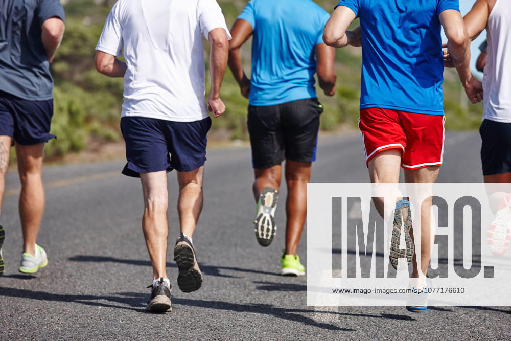Keeping fit with friends. Cropped rearview shot of a group of men running a road race (License=RF) 20242700 ,model released, Symbolfoto