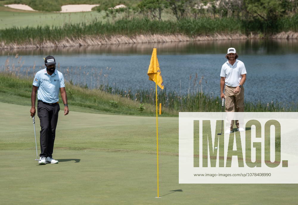 American Sahith Theegala, left, and Tommy Fleetwood, of England, line up their putts on the 7th green during the first round of the RBC Canadian Open in Caledon, Ont. on Thursday June 11, 2026. Canada News - June 11, 2026 - ZUMAc35_ 20260611_zaf_c35_036
