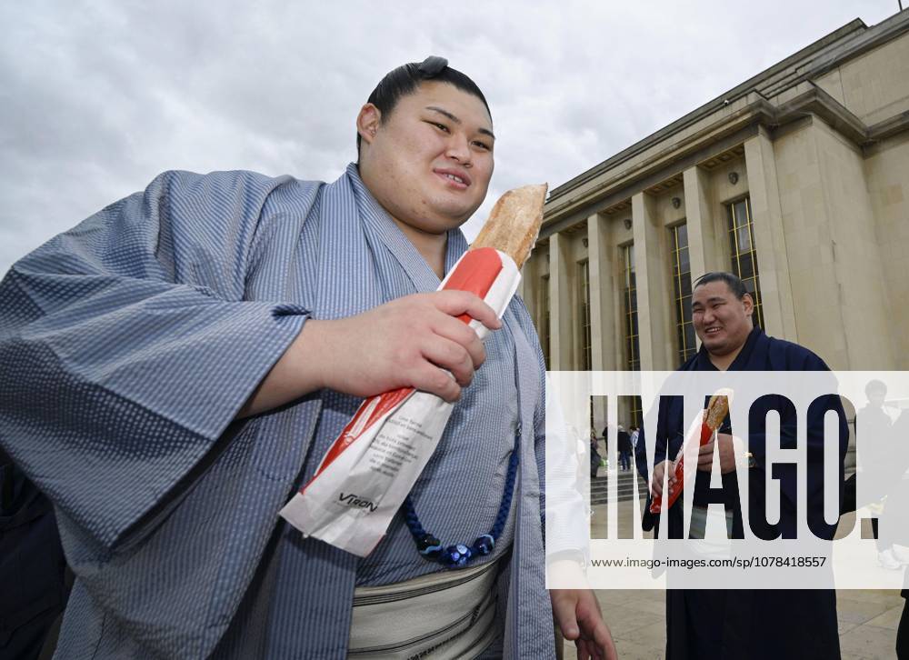 Sumo: Paris tournament Sumo grand champions Onosato (L) and Hoshoryu are pictured with baguettes while sightseeing around Paris landmark Eiffel Tower on June 11, 2026, ahead of a June 13-14 sumo tournament in the French capital. A14AA0005618478P
