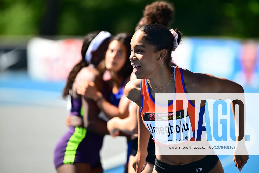 Joy Umegbolu 353, South Africa runs with visible joy and open mouth in the foreground, her starting license plate clearly shows the name Umegbolu and the event reference Mannheim 2026 In the background, two other athletes can be seen out of focus Joy Umegbolu sprinting at the 32 Junior Gala Mannheim 2026