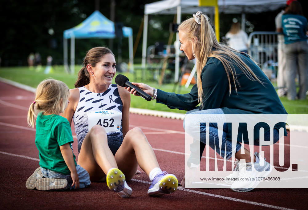 Merck Laufgala Pfungstadt, 13 06 2026 Interview with 1500m winner Gesa Felicitas Krause GER Silvesterlauf Trier with presenter Chantal Buschung To the left of Krause kneels her daughter Lola Merck Laufgala on 13 06 2026 in the TSV stadium in Pfungstadt Hesse