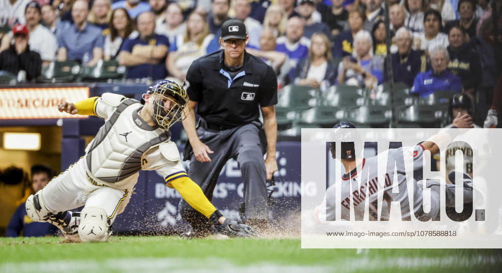 Home plate umpire Ryan Additon (C) watches as Cleveland Guardians center fielder Stuart Fairchild (R) scores past Milwaukee Brewers catcher William Contreras (L) on a double hit by Cleveland Guardians third baseman Gabriel Arias in the seventh inning of the MLB, Baseball Herren, USA game between the Cleveland Guardians and the Milwaukee Brewers at American Family Field in Milwaukee, Wisconsin on Tuesday, June 16, 2026. MIL20260616819 TANNENxMAURY