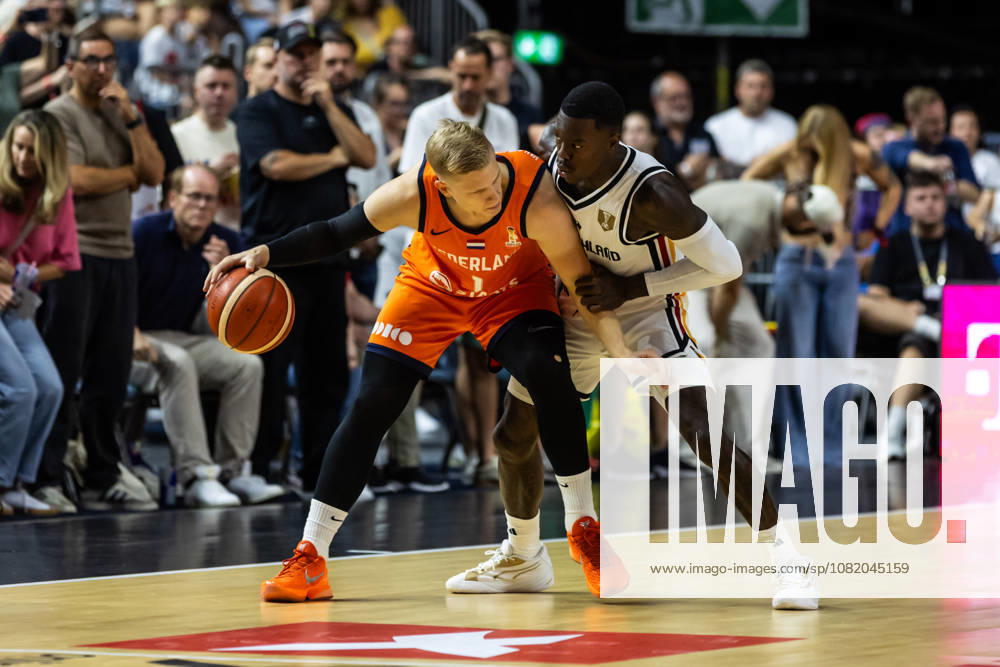 GER, FIBA 2027 Basketball World Cup, European Qualifiers, Cologne, Germany vs. Turkey, Keye van der Vuurst (Netherlands), 1, in a one-on-one matchup against Dennis Schroeder (Germany), 17, Cologne, LANXESS Arena, North Rhine-Westphalia, Germany
