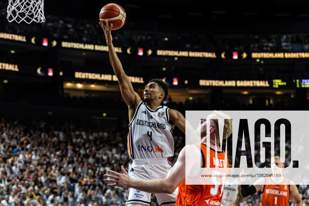 GER, FIBA 2027 Basketball World Cup, European Qualifiers, Cologne, Germany vs. Turkey; Maodo Lo (Germany), No. 4, in a one-on-one matchup against Rienk Mast (Netherlands), No. 51; Cologne, LANXESS Arena, North Rhine-Westphalia, Germany