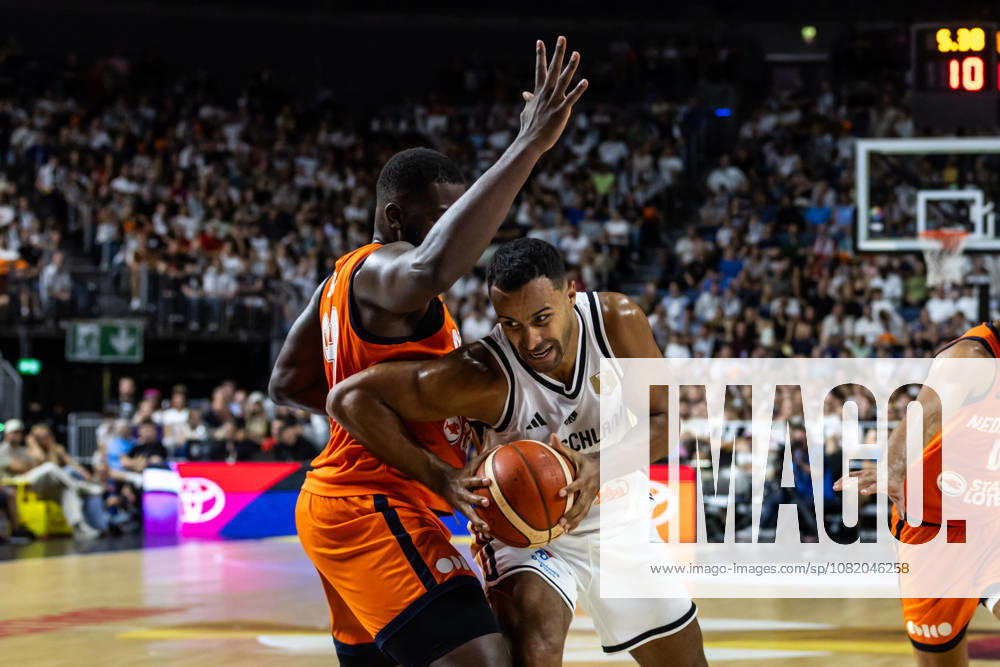 GER, FIBA 2027 Basketball World Cup, European Qualifiers, Cologne, Germany vs. Turkey, Johannes Thiemann (Germany), No. 32, in a one-on-one matchup against Nathan Kuta (Netherlands), No. 99, Cologne, LANXESS Arena, North Rhine-Westphalia, Germany
