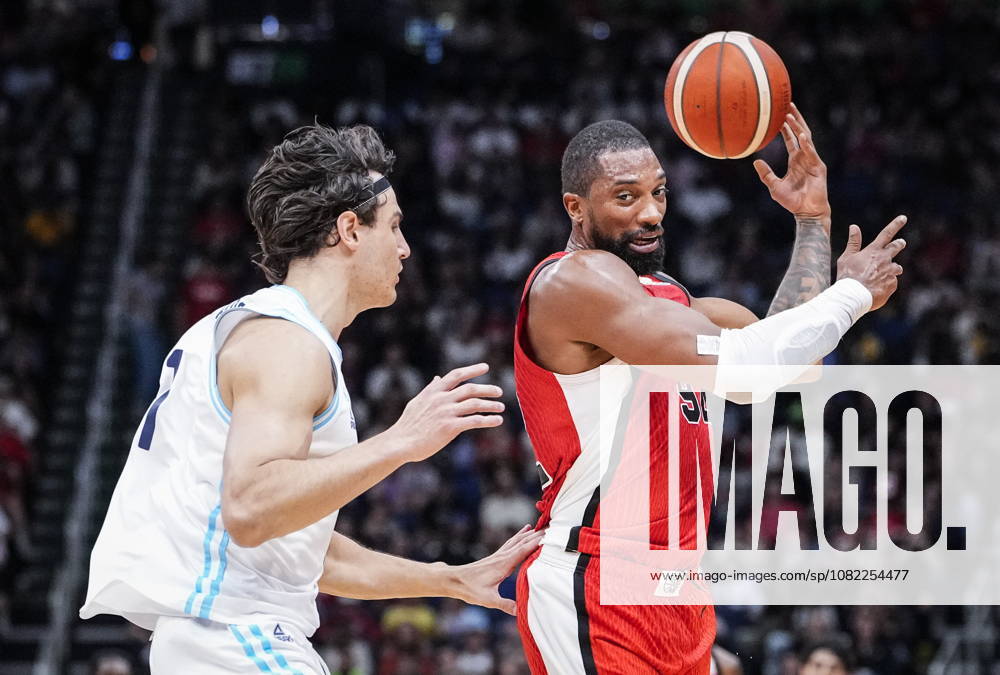 Canada s Khem Birch (92) passes the ball beside Argentina s Francisco Caffaro (1) during their FIBA world cup qualification action in Quebec City, Monday, Aug.Ã‚ 31, 2026. Francisco Caffaro (1) Khem Birch (92) - ZUMAc35_ 20260831_zaf_c35_091