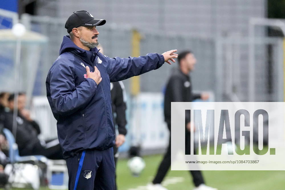 Stefan Kleineheismann, coach and head coach of TSG II, gives instructions, gesturing with his arms; single frame, single photo, action, October 18, 2026, Sinsheim, Germany, soccer, 3rd League, TSG 1899 Hoffenheim II vs. SC Verl; DFB and DFL regulations prohibit any use of photographs as image sequences and or quasi-video