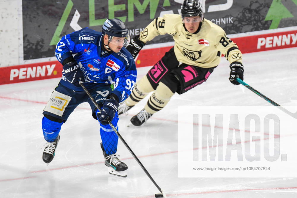 Straubing Tigers vs. Grizzlys Wolfsburg, Ice Hockey, German Ice Hockey League, Penny DEL, Matchday 10, 2026–2027 Season, October 18, 2026: Marcel Brandt of the Straubing Tigers has the puck ahead of Matt Choupani of the Grizzlys Wolfsburg, Men’s Ice Hockey, German Ice Hockey League, Penny DEL, Matchday 10, 2026–2027 Season on October 18, 2026, at the Eisstadion am Pulverturm, Straubing Tigers (blue) vs. Grizzlys Wolfsburg (beige)