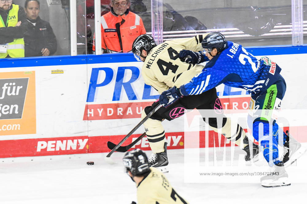Straubing Tigers vs. Grizzlys Wolfsburg, Ice Hockey, German Ice Hockey League, Penny DEL, Matchday 10, 2026–2027 Season, October 18, 2026: J. C. Beaudin of the Straubing Tigers at the boards with Julian Melchiori of the Grizzlys Wolfsburg, Men’s Ice Hockey, German Ice Hockey League, Penny DEL, Matchday 10, 2026–2027 season on October 18, 2026, at the Eisstadion am Pulverturm; Straubing Tigers (blue) vs. Grizzlys Wolfsburg (beige)