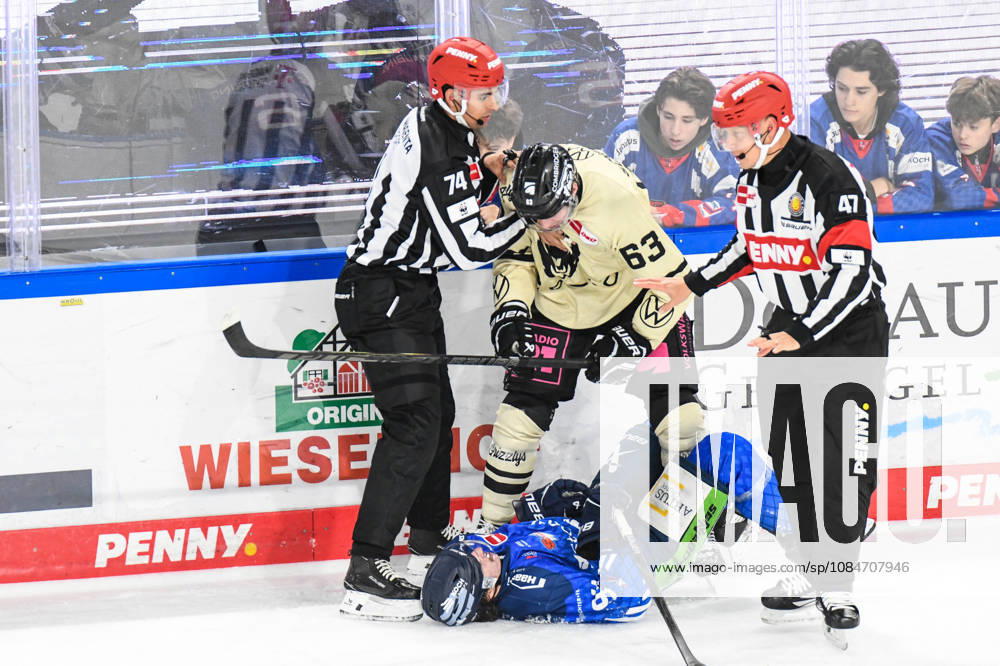 Straubing Tigers vs. Grizzlys Wolfsburg, Ice Hockey, German Ice Hockey League, Penny DEL, Matchday 10, 2026–2027 Season, October 18, 2026: Jamieson Rees of the Straubing Tigers lies on the ice in front of Luis Schinko of the Grizzlys Wolfsburg, Men’s Ice Hockey, German Ice Hockey League, Penny DEL, Matchday 10, 2026–2027 Season on October 18, 2026, at the Eisstadion am Pulverturm, Straubing Tigers (blue) vs. Grizzlys Wolfsburg (beige)