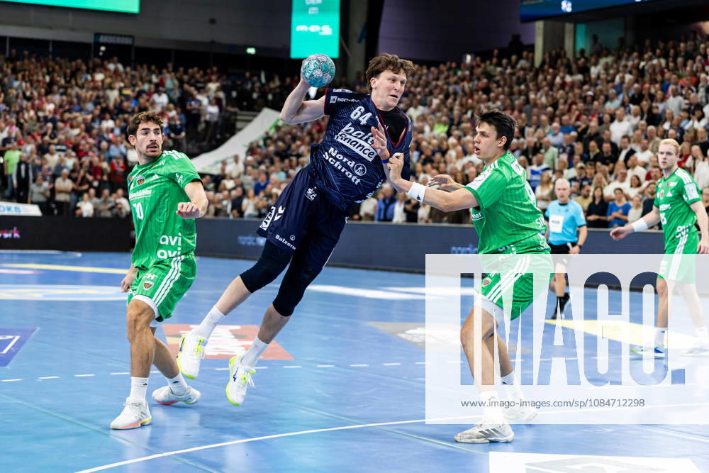 Opel HBL SG Flensburg Handewitt vs. Füchse Berlin 18 10 26 Lasse Kjaer Moller No. 64, SG Flensburg Handewitt vs. Aymeric Zaepfel No. 30, Füchse Berlin, and Frederik Simak No. 09, Füchse Berlin; Opel HBL SG Flensburg Handewitt vs. Füchse Berlin, GGW Arena on October 18, 2026