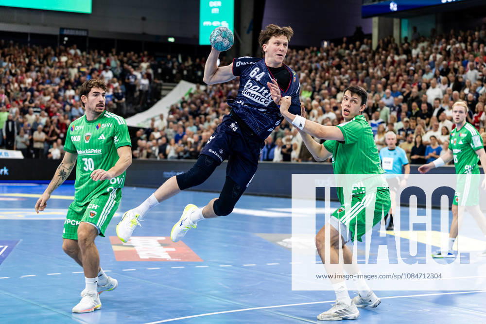 Opel HBL SG Flensburg Handewitt vs. Füchse Berlin 18 10 26 Lasse Kjaer Moller No. 64, SG Flensburg Handewitt vs. Aymeric Zaepfel No. 30, Füchse Berlin, and Frederik Simak No. 09, Füchse Berlin; Opel HBL SG Flensburg Handewitt vs. Füchse Berlin, GGW Arena on October 18, 2026