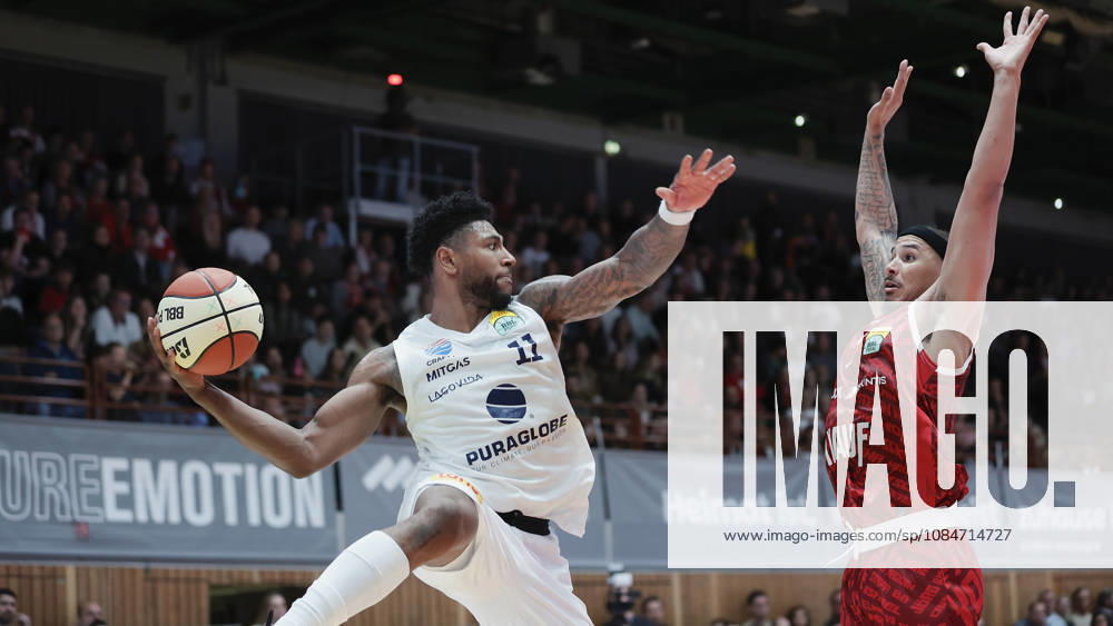 Pictured from left: Anthony Gaines of Syntainics MBC, No. 11, with the ball against Max Jones of Wuerzburg Baskets, February 18, 2026, Fitness First Wuerzburg Baskets vs. SYNTAINICS MBC, Netto BBL Cup, Round of 16, Germany, 97072, tectake Arena Wuerzburg,