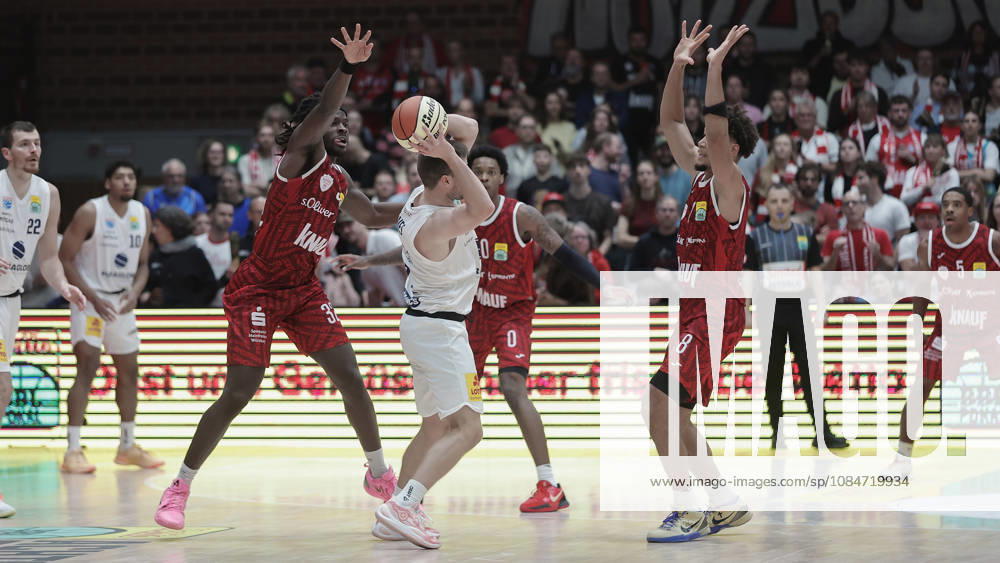 Pictured from left: Charles Thompson (Wuerzburg Baskets, 32), Spencer Reaves (SYNTAINICS MBC, 31) with the ball, Eddie Colbert III (Wuerzburg Baskets, 0), and Brandon Tischler (Wuerzburg Baskets, 8 18 10 2026), Fitness First Würzburg Baskets vs. SYNTAINICS MBC, Netto BBL Cup, Round of 16, Germany, 97072, tectake Arena Würzburg,