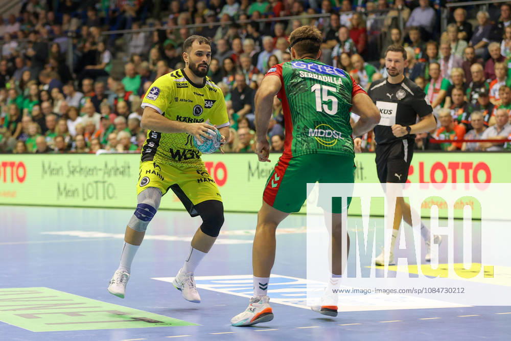 Handball Opel HBL SC Magdeburg vs. TVB Stuttgart, from left: Mohamed Amine Darmoul (Stuttgart), 70, Antonio Serradilla (Magdeburg), 15; duel, battle, tackle, Magdeburg