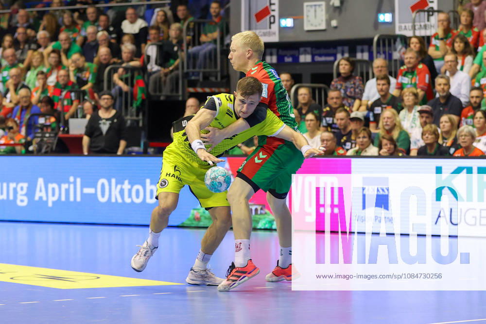 Handball Opel HBL SC Magdeburg vs. TVB Stuttgart, from left: Simone Mengon (Stuttgart), 15, Magnus Saugstrup (Magdeburg), 23; duel, battle, tackle, Magdeburg