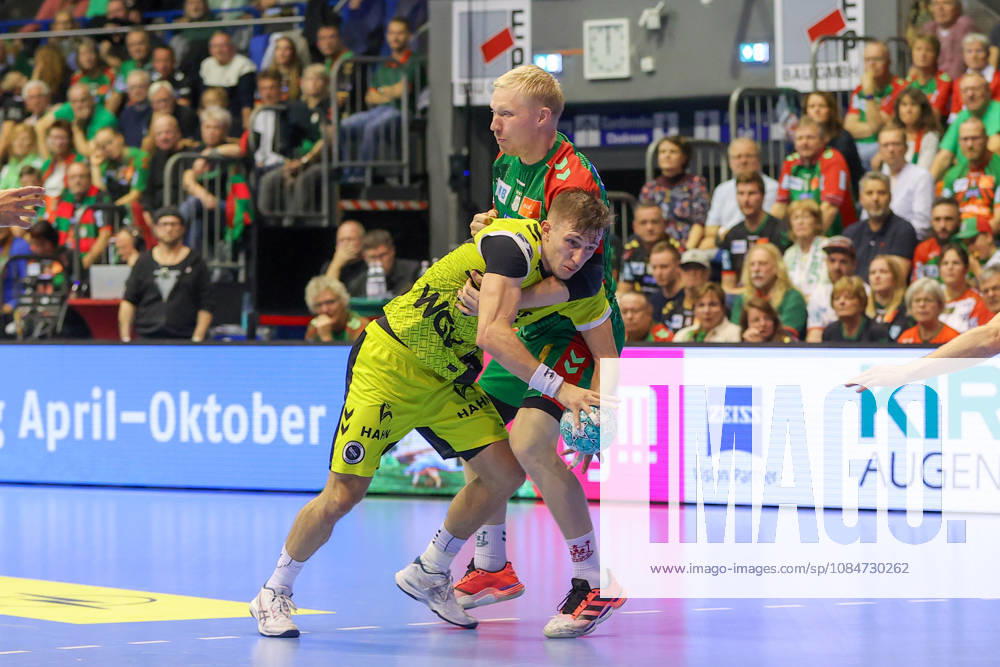 Handball Opel HBL SC Magdeburg vs. TVB Stuttgart, from left: Simone Mengon (Stuttgart), 15, Magnus Saugstrup (Magdeburg), 23; duel, battle, tackle, Magdeburg