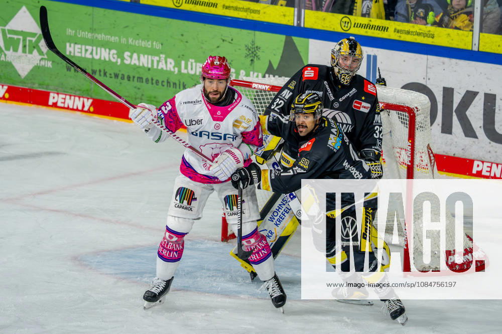 Ice Hockey, DEL, Krefeld Pinguine vs. Eisbären Berlin, 2026–27 Season, YAYLA Arena, Krefeld; Andreas Eder of the Eisbären Berlin (No. 43) battles C. J. Suess of the Krefeld Pinguine (No. 27) in front of the net defended by goalie Juha Jatkola of the Krefeld Pinguine (No. 32); North Rhine-Westphalia, Germany