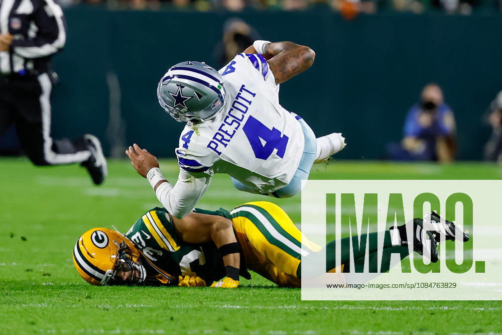 Oct 18, 2026; Green Bay, WI, USA; Dallas Cowboys quarterback Dak Prescott (4) is tackled by Green Bay Packers safety Evan Williams (33) during the NFL, American Football Herren, USA game at Lambeau Field. Mandatory Credit: -Cal Media. NFL 2026: Cowboys Vs Packers OCT 18 - ZUMAc04_ 20261018_zma_c04_489