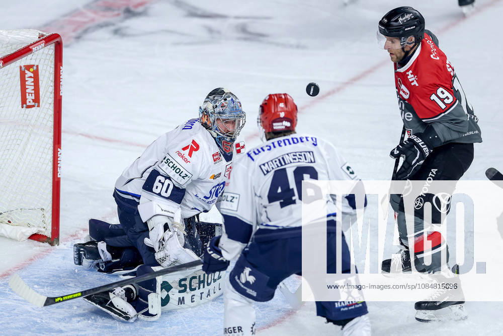 Ice hockey, DEL, Kölner Haie vs. Schwenninger Wild Wings, Matchday 49, 2026–27 season, Lanxess Arena, Cologne; Frederik Storm of the Kölner Haie (No. 19) attacking the goal defended by Joacim Eriksson (SWW No. 60), North Rhine-Westphalia, Germany
