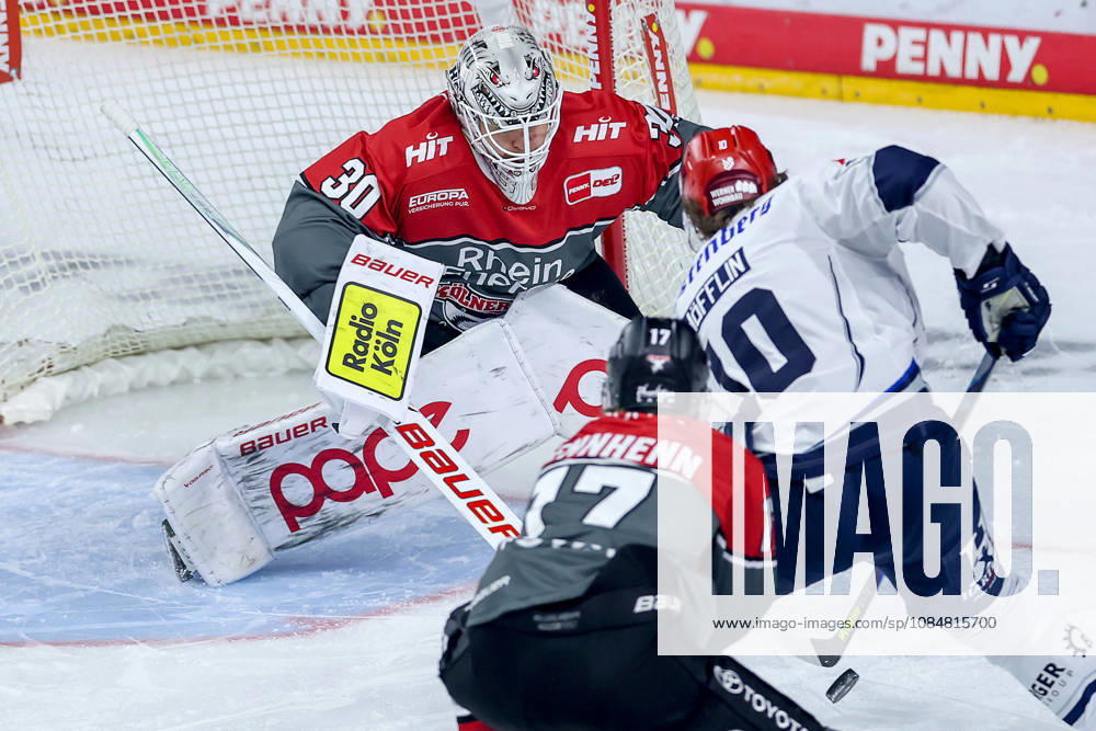 Ice hockey, DEL, Kölner Haie vs. Schwenninger Wild Wings, Matchday 49, 2026–27 season, Lanxess Arena, Cologne. Goalie Janne Juvonen of the Kölner Haie (No. 30) defends the net against Mirko Höfflin of the SWW (No. 10), North Rhine-Westphalia, Germany