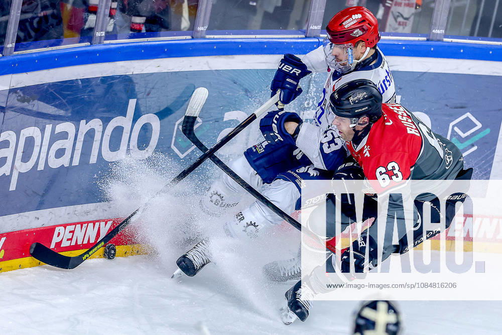 Ice Hockey, DEL, Kölner Haie vs. Schwenninger Wild Wings, Matchday 49, 2026–27 Season, Lanxess Arena, Cologne: Alex Trivellato (SWW 53) battles Patrick Russell (Cologne Sharks 63) for the puck along the boards in North Rhine-Westphalia, Germany