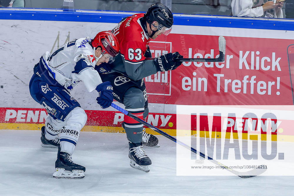 Ice hockey, DEL, Kölner Haie vs. Schwenninger Wild Wings, Matchday 49, 2026–27 season, Lanxess Arena, Cologne; Curtis Valk (SWW 14) in a one-on-one battle against Patrick Russell (Kölner Haie 63), North Rhine-Westphalia, Germany